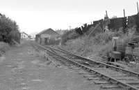 The Caledonian route to Granton in June 1978. The line is seen here running down the gradient from Breakwater Junction towards Granton Square and harbour with the line into the former goods depot turning off to the right. The route had been closed to all traffic north of Crew Junction in 1965. [See image 3220].<br>
<br><br>[Bill Roberton /06/1978]