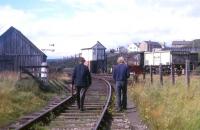 The shunting team returning along the harbour branch to Invergordon goods yard in the summer of 1973, including (on the right) the proverbial 'man with the red flag' - to take the train across the main road through Invergordon.<br><br>[David Spaven //1973]