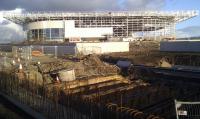 View towards Glasgow's the new velodrome in April 2011. The road has been lifted to show the steel beams that spanned London Road adjacent the the ventilation shaft. You can just make out the 6 deep brickwork of the Tunnel in the foreground.  <br><br>[Colin Harkins 11/04/2011]