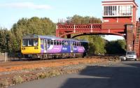 A Carlisle - Newcastle service passing below Hexham's SB gantry on 25 September 2011, soon after restarting from Hexham station.<br><br>[John Steven 25/09/2011]