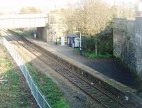 In a cutting surrounded on all sides by high walls and bridge parapets Burnley Barracks is not an easy station to photograph. Once staffed it is now one of several unstaffed halts on the surviving single line branch to Colne. This view looks down the gradient towards Burnley Central in September 2011.<br><br>[Mark Bartlett 29/09/2011]