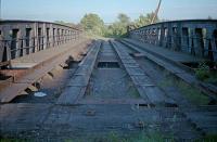 View east over Bowling Swing Bridge in 1987. Bowling Swing Bridge Signalbox was elevated over the top of this bridge, now a fixed span, which crosses the Forth and Clyde Canal. [See image 35890]<br><br>[Ewan Crawford //1987]