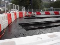 Limit of tram tracks running east on Princes Street at the junction with Waverley Bridge, with rails exposed during major remedial works on 4 October 2011. Road traffic can be seen turning right from Waverley Bridge to go forward past the Balmoral Hotel or turn left towards the planned tram terminus site in St Andrew Square. <br><br>[David Pesterfield 04/10/2011]