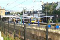 The west end of Haymarket station on the afternoon of 27 September, seen from alongside the tramworks in Haymarket Yards. Platform 0 is vacant but all 4 of the through platforms are occupied. Platforms 1 and 2 contain incoming and outgoing Fife Circle services, with the former running through to Newcraighall. At platform 3 is the 11.40 ex-Helensburgh Central, bound for Waverley, and at platform 4 is the 13.37 Waverley - Milngavie.<br>
<br><br>[John Furnevel 27/09/2011]