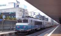 SNCF 522398 <I>Coudekerque Branche</I> prepares to depart north from Grenoble on 27 September 2011 with a regional express service. In the background is the famous Business School in the city's high-tech quarter.<br><br>[Andrew Wilson 27/09/2011]