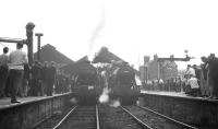 Black 5 no 45407 (left) and 8F no 48476 at Blackburn Station on 4 August 1968 in connection with the RCTS <I>End of Steam Commemorative Rail Tour</I>. (The train itself is standing off picture to the left.) 48476 has just come off the train, having piloted 73069 from Manchester Victoria, while 45407 is about to take its place in front of 73069. The pair will then take the special forward to Hellifield and Skipton, returning via Burnley to Lostock Hall.<br><br>[K A Gray 04/08/1968]