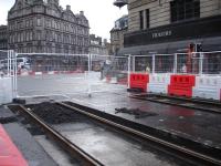 Great Expectations. Excavated western end of tram track formation on Princes Street, by the junction with Lothian Road, looking to all intents as if quietly awaiting the arrival of tracks that should now be laid along Shandwick Place to link up the remote island to the rest of the burgeoning tram network.<br><br>[David Pesterfield 04/10/2011]