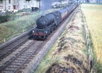 Long time Ferryhill resident V2 no 60888 heading home in the summer of 1959 as it takes a passenger train away from Edinburgh, having just turned north at Saughton Junction.<br><br>[A Snapper (Courtesy Bruce McCartney) 25/07/1959]