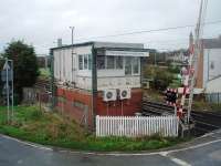 In need of a bit of TLC - but unlikely to get it. Hest Bank signal box overlooks the foreshore, and has always taken a battering from the weather, and is looking particularly shabby at the moment. However, it is now identified for closure with control of the crossing passing to Preston Power Box and so unlikely to be refurbished again.<br><br>[Mark Bartlett 10/10/2011]