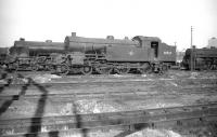 Urie class H2 4-6-2T no 30520 stands in the extensive sidings at Nine Elms shed in October 1959. The so-called <I>Green Tanks</I>,  introduced in 1921, were specifically designed to handle heavy short-trip regional interchange freights operating from Feltham yard. All 5 of the class were withdrawn and cut up in 1962.<br><br>[Robin Barbour Collection (Courtesy Bruce McCartney) 03/10/1959]