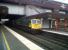 Freightliner 66567 emerges from the stygian depths of Birmingham International with a Northbound container train on 21 July. The light was starting to fade, but the train was just restarting after a crew change.<br><br>[Ken Strachan 21/07/2011]