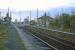 A plethora of poles characterized the station at Westerfield on 26th November 1977 - the station lighting was being upgraded. This was the view east towards the junction with the Felixstowe branch. The manual level crossing gates in the picture were retained for another 13 years.<br><br>[Mark Dufton 26/11/1977]