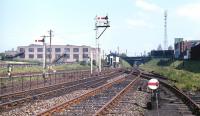 View east at Lochend Junction in the late spring of 1971, with one of the floodlights of Meadowbank Stadium in the right background. The spur from London Road Junction is on the immediate left of the camera and beyond that the tracks to Easter Road Junction are seen dipping down to pass under the London Road Junction to Leith Central line. Furthest left is the spur to Lochend North Junction and Leith Central.<br><br>[Bill Jamieson //1971]