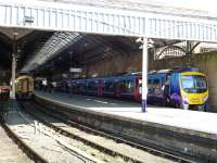 The 12.45 to Liverpool Lime Street waits to leave Scarborough platform 5 on 28 September, while platform 4 hosts a recent class 158 arrival off the Yorshire Coast line.<br><br>[Colin Miller 28/09/2011]