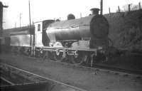 J37 0-6-0 no 64630 on Dunfermline shed in February 1959. The embankment above carries the Stirling and Dunfermline route, running left towards Dunfermline Upper station.<br><br>[Robin Barbour Collection (Courtesy Bruce McCartney) 11/02/1959]