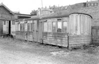 An elderly 5-compartment grounded coach in use as a store at Newburgh, Fife, in April 1978. Closed to passengers in September 1955, the yard was still in use at this time for coal traffic.<br>
<br><br>[Bill Roberton /04/1978]