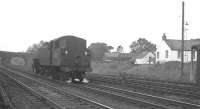 Fairburn 2-6-4T no 42125 returning back down the bank towards Beattock shed in the early 1960s. The Moffat branch runs through the arch on the right hand side of the bridge. <br><br>[K A Gray //]