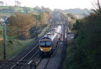 185149 heads north at Galgate with a Manchester Airport to Edinburgh service late in the afternoon of 15 October 2011. The former Galgate station (closed in 1939) was located in the background. <br>
<br><br>[John McIntyre 15/10/2011]