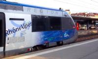 A TER Rhone Alpes X73500 dmu regional service prepares to depart from Grenoble on an early evening service on 27 September, while a Burgundy regional express stands in the platform beyond.<br><br>[Andrew Wilson 27/09/2011]