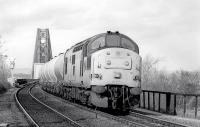 37188 heads south off the Forth Bridge with empty fuel tanks from Linkswood (RAF Leuchars) on 17 March 1992.<br>
<br><br>[Bill Roberton 17/03/1992]
