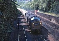 6843 crawls east through Princes Street Gardens on a bright and sunny 19 June 1970 with the morning Bowling - Granton Esso tanks. The train was subsequently held for a time at Waverley awaiting the road via Abbeyhill Junction [see image 35800]<br><br>[Bill Jamieson 19/06/1970]