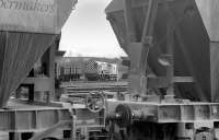 A Class 08 diesel shunter is framed by two Tullis Russell hopper wagons at Thornton Yard on 18 March 1992. All will head for the Auchmuty branch in due course.<br>
<br><br>[Bill Roberton 18/03/1992]