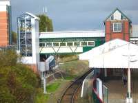 New footbridge section and lift tower at Wrexham General to allow step-free access from the ticket office and platforms 1 -3 to platform 4. View is from Mold Road overbridge (the present step-free route) on 12 October. Platform 3 runs through the centre of the picture and the Bidston line serving platform 4 is visible under the new footbridge. The goods line through platform 3, the former Wrexham & Shropshire platform, links to the Bidston line just north of the station to provide access to Dee Marsh for steel trains from South Wales.<br><br>[David Pesterfield 12/10/2011]