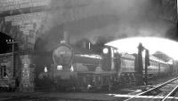 65033 with the joint RCTS (N.E. Branch)/Stockton & Darlington Locomotive Society J21 Rail Tour at Kirkby Stephen East on 7 May 1960. The locomotive is standing below the A685 road bridge prior to heading back to Darlington via Stainmore.<br>
<br><br>[K A Gray 07/05/1960]