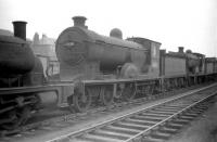 Scott class 4-4-0 no 62428 <I>The Talisman</I> stored awaiting disposal in Bathgate yard in April 1959, four months after withdrawal from Hawick shed. 62428 was subsequently cut up at Motherwell Machinery & Scrap, Wishaw, in February 1960.<br><br>[Robin Barbour Collection (Courtesy Bruce McCartney) 21/04/1959]