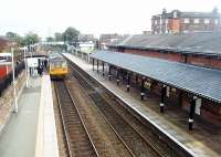 The Rainhill Locomotive Trials of 1829 are so embedded in railway history that it is surprising to learn that Rainhill station was known as Kendricks Cross until 1843. It makes the most of its heritage now though and there are numerous display boards and plaques marking its significance. The station building itself, with its distinctive awning, dates from 1870 and is still staffed. A Manchester bound Pacer calls on a Northern stopping service from Liverpool.<br><br>[Mark Bartlett 13/10/2011]