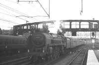 Britannia Pacific no 70045 <I>Lord Rowallan</I> (minus nameplate) arrives with a WCML service at Glasgow Central in the summer of 1966.<br><br>[K A Gray 30/07/1966]