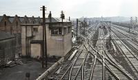 View south east from Polmadie Road bridge on 13 March 1971 showing Polmadie signalbox, a wartime construction dating from about 1940. Beyond the box on the left is the shed yard with the noses of a Clayton and an EE Type 1 visible, otherwise little sign of life.<br><br>[Bill Jamieson 13/03/1971]