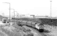 47283 departs from Leith South with a fertiliser van train on 28 August 1991, passing stacks of pipes which have also arrived by rail. The former traffic has vanished, while pipe traffic is intermittent.<br>
<br><br>[Bill Roberton 28/08/1991]