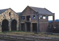 The disused coaling stage at Ladybank shed photographed on the occasion of an EURS brake van trip over the then freight only line to Hilton Junction on 3 March 1971. Ladybank still operated a class 08 DE pilot at that time and this is stabled just out of frame next to the brake van on the right. Latterly a sub shed to 62A Thornton Junction, Ladybank shed was officially closed in December 1958 and demolished during the 1970s.<br><br>[Bill Jamieson 03/03/1971]