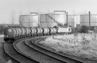 26037 arrives at its destination at Menstrie on 22 January 1991 with a train of molasses tanks [see image 36151].<br><br>[Bill Roberton 22/01/1991]