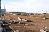 Looking west across the area around the planned tram interchange at Edinburgh Park on 26 October with the tram route rising to cross the E&G on the flyover before turning north towards the airport. On the right a non-stop service is about to run through the station heading for Waverley.   <br><br>[John Furnevel 26/10/2011]