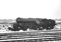 Gresley V2 2-6-2 no 60963, one of a small number of the class to be fitted with a double chimney, stands in the snow at the north end of Darlington in the early 1960s.<br><br>[K A Gray //]