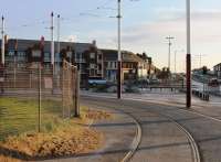 The rails, poles and catenary are back at Starr Gate, although Blackpool's trams aren't running here yet and the turning circle will no longer be used for public services as it now leads into the new depot via the washing plant. For a Then, Then and Now comparison covering two years at this location [see image 30206].<br><br>[Mark Bartlett 26/10/2011]