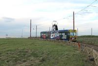 The turning circle at Little Bispham has not been used much in recent years but in 2011 saw a tram every few minutes as, with the line to Cleveleys and Fleetwood still being rebuilt, it was the northern limit of operations. Tram 647 negotiates the tight curve before returning to Pleasure Beach. Just off shore is one of Blackpool's controversial gas drilling platforms. <br><br>[Mark Bartlett 26/10/2011]