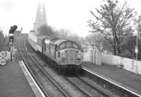 The first consignment of London Underground stock for refurbishment at Babcock Rosyth arrives in Fife behind 37 083 on 28 October 1991<br>
<br><br>[Bill Roberton 28/10/1991]