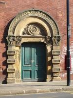 Ornate stone surround to a little used door alongside Wakefield Westgate station, photographed in June 2011. The door is part of the original up side sub-structure, giving access to the undercroft. The Fleur-de-Lys emblem of the City Of Wakefield is incorporated within the centre boss over the door.<br><br>[David Pesterfield 02/06/2011]