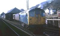 Scene in the yard at Dingwall in the spring of 1971 as a Class 26 collects a milk van for attachment to the mid-morning Inverness-Kyle train. On Mondays to Fridays, the van was picked up by the early-morning daily freight from Inverness to Kyle, which in latter years became a mixed passenger, parcels and freight operation.<br>
<br><br>[David Spaven //1971]