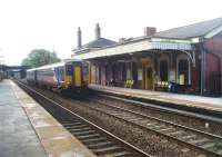 Drawing up alongside the original, and still staffed, station building at Prescot on 13 October is 156472 on a stopping service from Liverpool to Wigan. This view looks towards Huyton and will change soon as the electrification of the line proceeds. <br><br>[Mark Bartlett 13/10/2011]