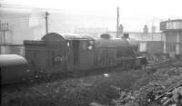 Standing in the rain outside Heaton shed in the spring of 1962, Gresley V1 2-6-2T no 67637 looks to have seen better days. The locomotive was officially withdrawn in May that year.<br><br>[K A Gray //1962]