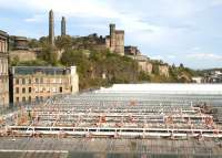 <I>Up on the roof.</I> Work in progress on the roof of Waverley station. The old glass roof is in the process of being replaced by more than 24,000 (twenty four thousand) clear glass panels, installed as part of a 3 year project for completion in 2013. The objective is <I>'...to flood the station with natural light and totally improve the environment for passengers'.</I> [See image 57576]<br><br>[John Furnevel 27/09/2011]