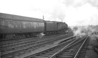 A4 no 60002 <I>Sir Murrough Wilson</I> heads south out of Carlisle on 30 June 1963 at the head of the 9.20am Glasgow St Enoch - London St Pancras. The Pacific will take the train as far as Leeds City.<br><br>[Robin Barbour Collection (Courtesy Bruce McCartney) 30/06/1963]