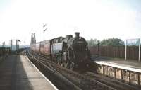 Stirling shed's BR Standard 2-6-4T no 80125 brings an Edinburgh bound train off the Forth Bridge and into Dalmeny station in the summer of 1959. <br><br>[A Snapper (Courtesy Bruce McCartney) 08/08/1959]