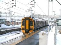 A Bathgate - Waverley 158 service stands at platform 1 at a snowy Bathgate station on 14 December 2010. An action plan aimed at minimising the impact of adverse weather conditions during the coming winter has recently been launched by First ScotRail [see news item].<br><br>[John Furnevel 14/12/2010]