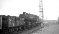 Ivatt 2-6-0 no 43022 of Bescot shed, takes a freight past the station in October 1964. (Note the station was renamed Bescot Stadium in 1991.)<br><br>[K A Gray 22/10/1964]