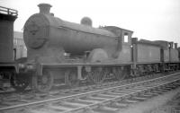 Having been withdrawn from Hawick shed at the end of 1958, Scott class 4-4-0 no 62422 <I>Caleb Balderstone</I> languishes in the 'stored' locomotive sidings at Bathgate in April 1959. The locomotive was cut up at MMS, Wishaw, the following February.<br><br>[Robin Barbour Collection (Courtesy Bruce McCartney) 21/04/1959]